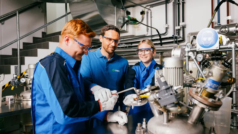 Two workers and an apprentice in OMV production facility.